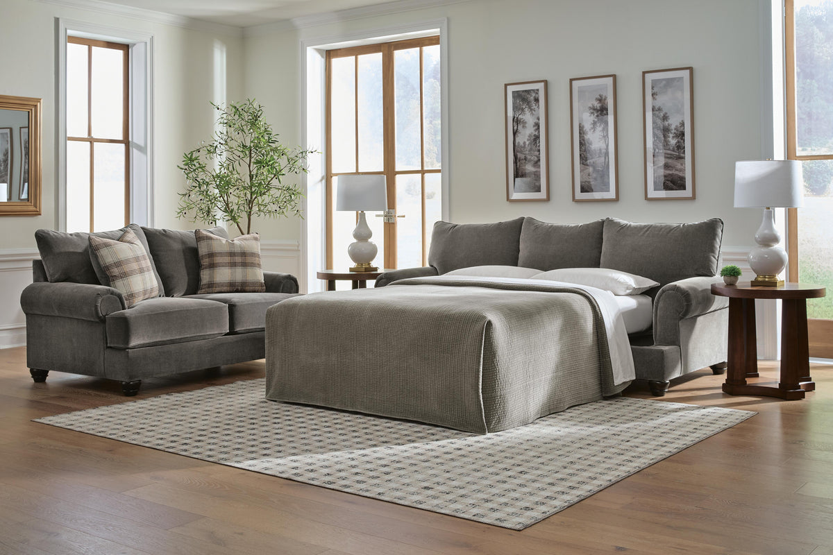 Tallow Creek queen sofa sleeper opened into a bed in a living room, Kensington Furniture