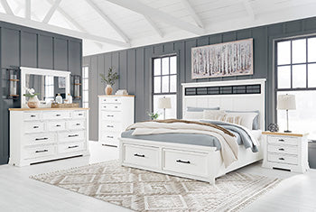 Ashbryn Nightstand — Three Drawers, Dual USB Farmhouse Benchcraft® Bedroom