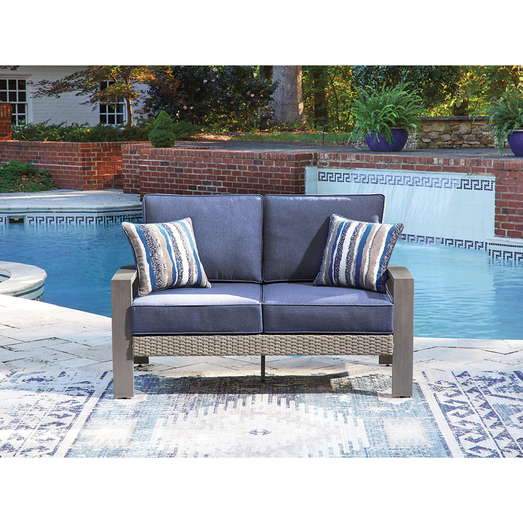 Half Moon Beach Outdoor Loveseat with Cushion Signature Design by Ashley® Outdoor