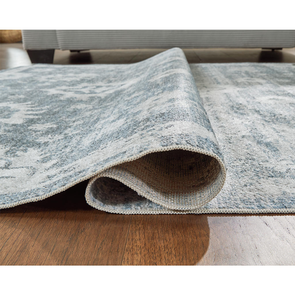 Avanworths Washable 5'3" x 7' Area Rug Signature Design by Ashley® Rugs